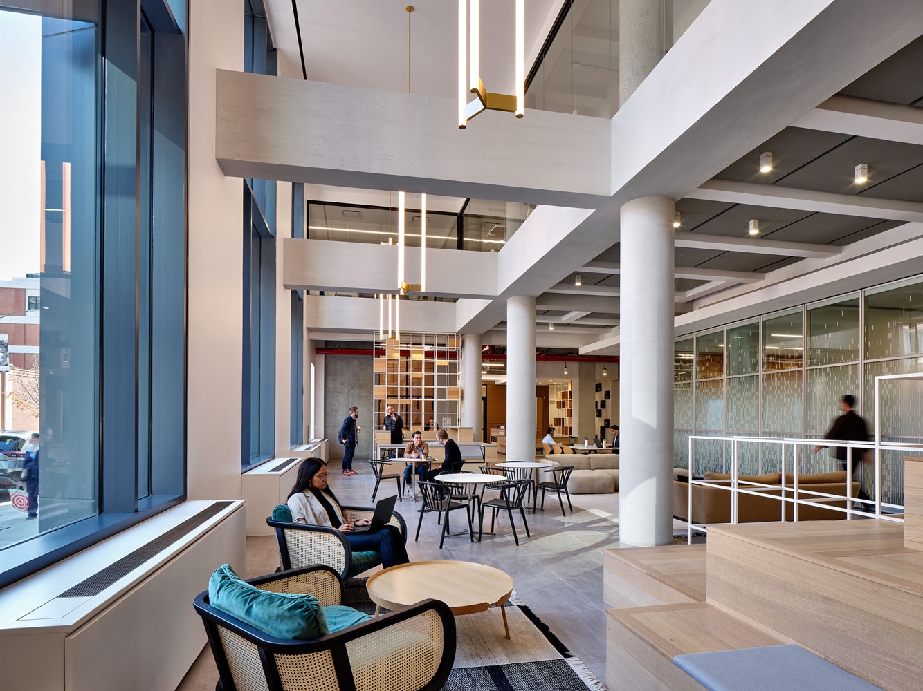 Employees working in a comfortable common area with natural light