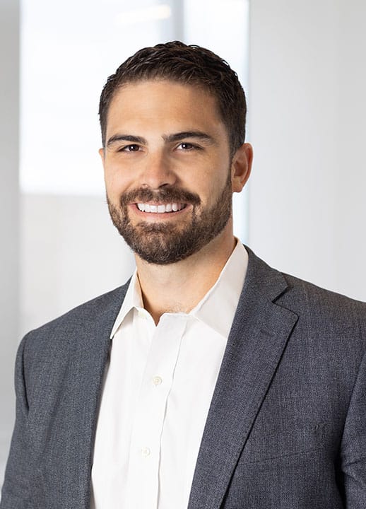 Corporate headshot of Managing Director/ Partner Tyson Reynoso